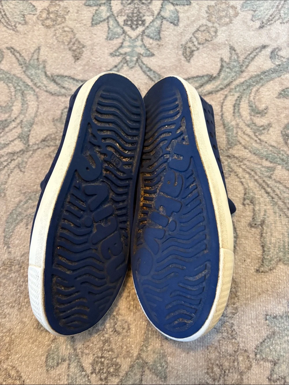 Navy blue boys Native shoes.
